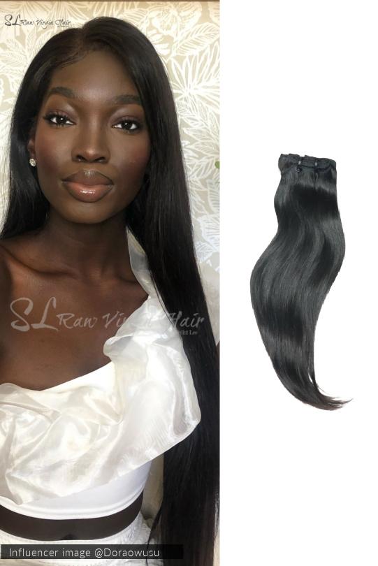 Beautiful African American woman wearing SL Raw Natural Straight Vietnamese human hair extension in 100grams of hair. hair comes in natural black and hold curls beautifully 