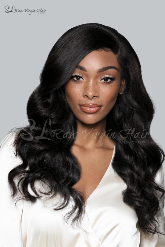 Beautiful black woman - SL Raw Girl wearing Side part 20" Long Natural Wavy Natural Black Lace Front wig with a 13x4 Frontal. Free parting hair. Baby hairs. Beautiful natural hairline. Lace Front Wig so easy to apply on for everyday wear.